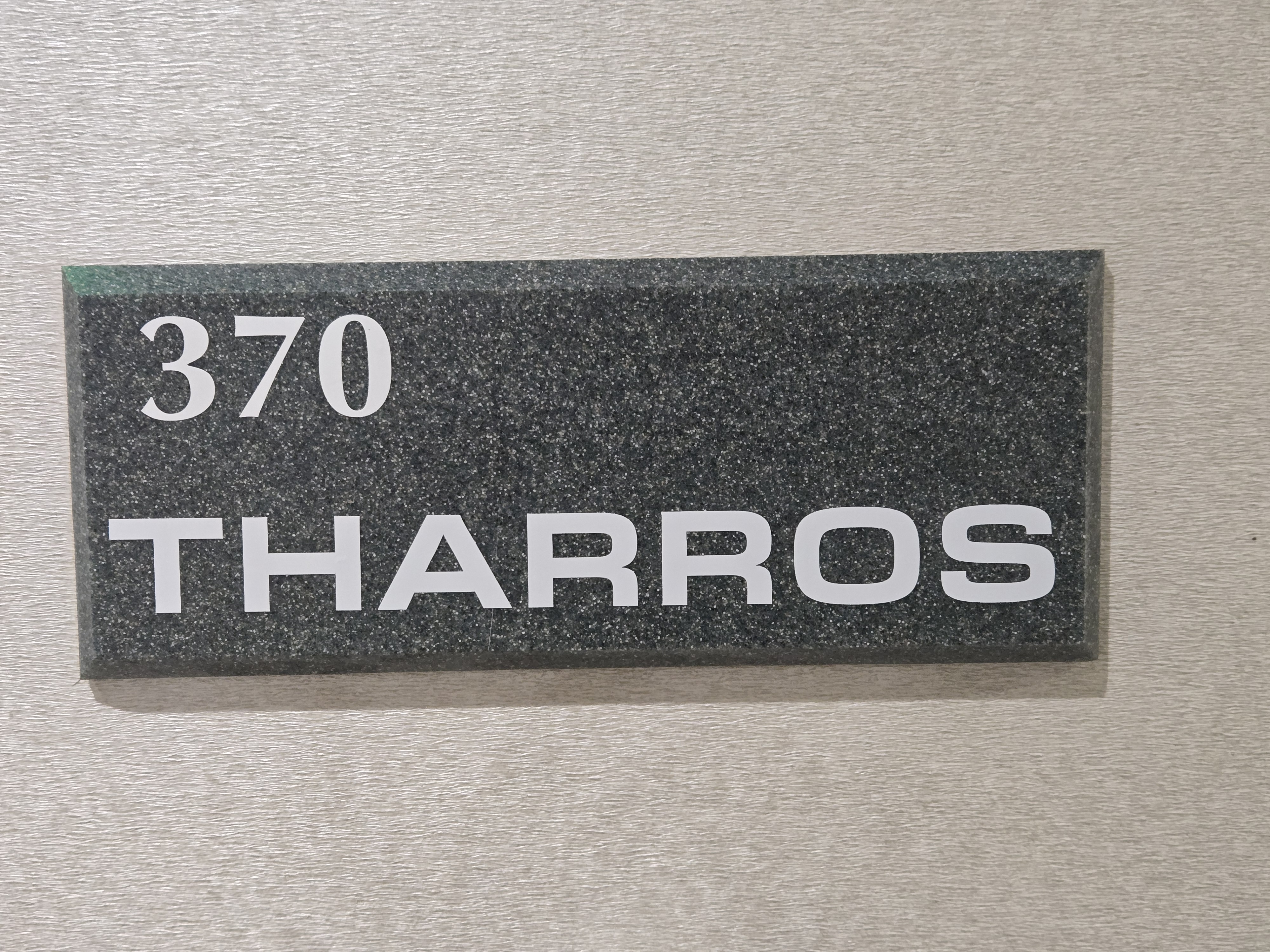 Tharros nameplate signage