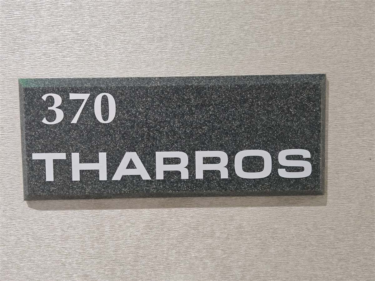 Tharros nameplate signage
